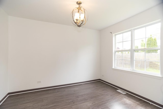 10 Sugar Creek Ct, Lake In The Hills, IL 60156 - spare room featuring a chandelier and wood finished floors