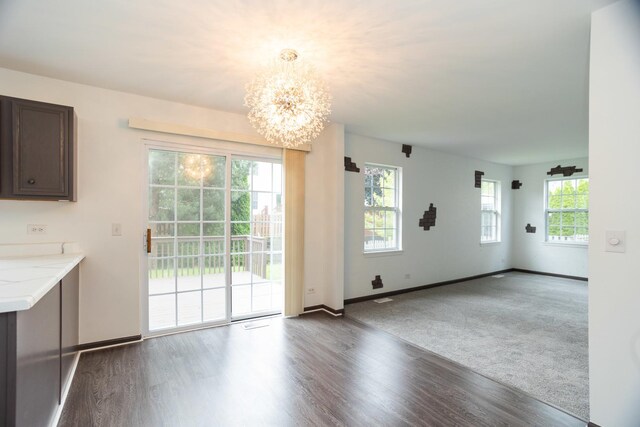10 Sugar Creek Ct, Lake In The Hills, IL 60156 - unfurnished dining area with a chandelier and wood finished floors