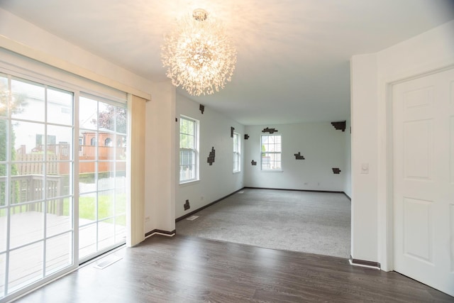 10 Sugar Creek Ct, Lake In The Hills, IL 60156 - empty room featuring a chandelier and wood finished floors
