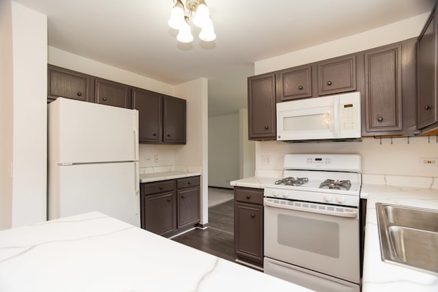 10 Sugar Creek Ct, Lake In The Hills, IL 60156 - kitchen with white appliances, dark wood-style flooring, and dark brown cabinetry