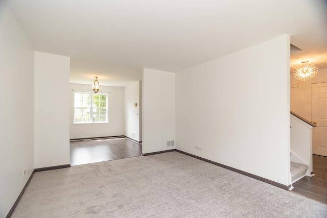 10 Sugar Creek Ct, Lake In The Hills, IL 60156 - carpeted spare room with a chandelier and stairs