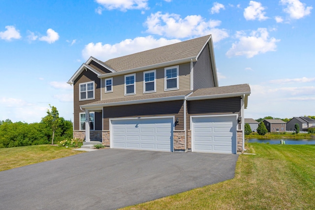 2042 Legacy Pointe Blvd, Plainfield, IL 60586 - view of front of house featuring driveway, a water view, a front yard, and stone siding