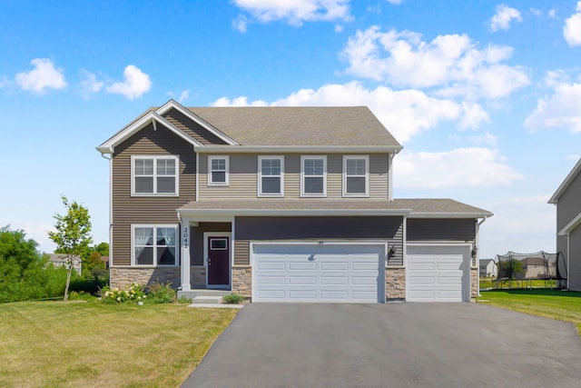 2042 Legacy Pointe Blvd, Plainfield, IL 60586 - view of front of house featuring driveway, a front yard, stone siding, a garage, and roof with shingles