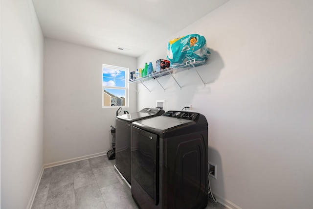 2042 Legacy Pointe Blvd, Plainfield, IL 60586 - laundry area with separate washer and dryer and baseboards
