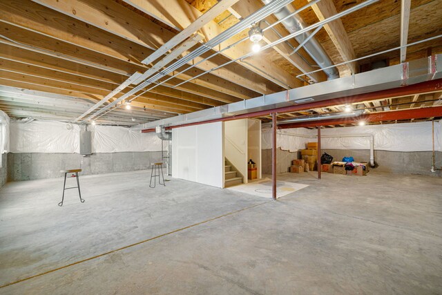 2042 Legacy Pointe Blvd, Plainfield, IL 60586 - unfinished basement featuring electric panel and stairway