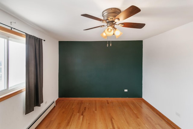 9407 S Roberts Rd Unit 3Se, Hickory Hills, IL 60457 - empty room featuring baseboard heating, healthy amount of natural light, light wood-style floors, and ceiling fan