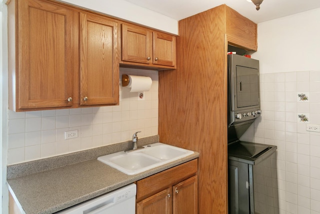 9407 S Roberts Rd Unit 3Se, Hickory Hills, IL 60457 - kitchen featuring stacked washing machine and dryer, tile walls, brown cabinetry, dishwasher, and backsplash