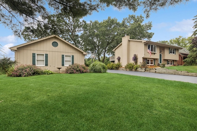 2619 Baldwin Rd, Mchenry, IL 60050 - view of front facade featuring a chimney and a front lawn