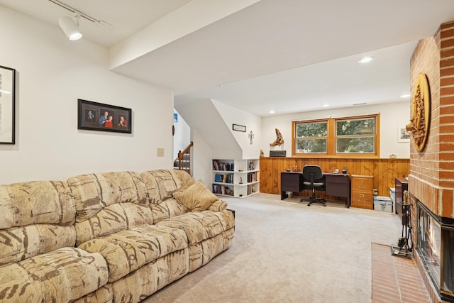 2619 Baldwin Rd, Mchenry, IL 60050 - living area featuring carpet flooring, a desk, wood walls, track lighting, and stairway