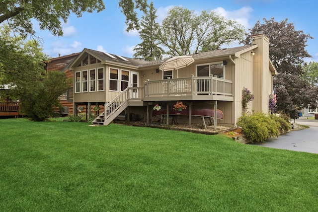 2619 Baldwin Rd, Mchenry, IL 60050 - back of house featuring stairs, a wooden deck, a chimney, a sunroom, and a yard