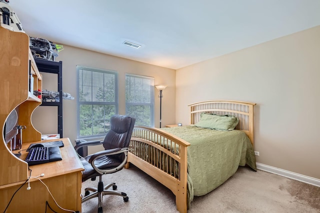233 Pawtucket Ave, Elgin, IL 60124 - carpeted bedroom with an office area and baseboards