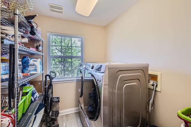 233 Pawtucket Ave, Elgin, IL 60124 - laundry room with separate washer and dryer and wood finished floors