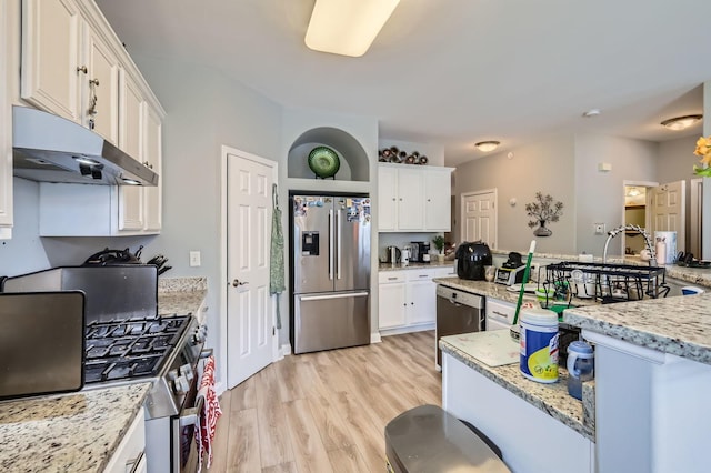 233 Pawtucket Ave, Elgin, IL 60124 - kitchen featuring stainless steel appliances, under cabinet range hood, white cabinetry, light wood-style flooring, and light stone countertops