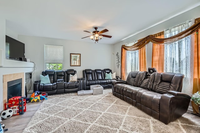 233 Pawtucket Ave, Elgin, IL 60124 - living area featuring wood finished floors, a ceiling fan, and a tiled fireplace