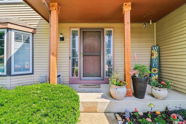 5506 W Chasefield Cir, Mchenry, IL 60050 - view of exterior entry featuring covered porch