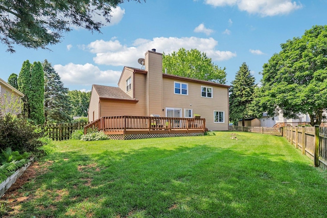 5506 W Chasefield Cir, Mchenry, IL 60050 - rear view of property with a chimney, a fenced backyard, and a wooden deck