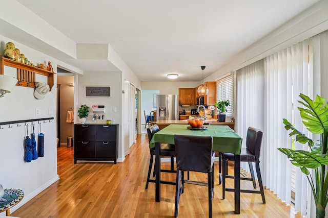 5506 W Chasefield Cir, Mchenry, IL 60050 - dining space with light wood-style floors and baseboards
