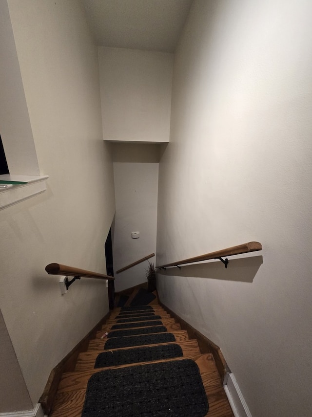 1007 S Oak Park Ave Unit E, Oak Park, IL 60304 - staircase featuring wood finished floors and baseboards