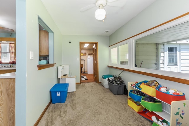 1014 N Main St, Pontiac, IL 61764 - recreation room with carpet, healthy amount of natural light, and a ceiling fan