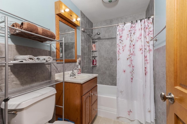1014 N Main St, Pontiac, IL 61764 - bathroom with tile walls, shower / bath combo with shower curtain, vanity, and tasteful backsplash
