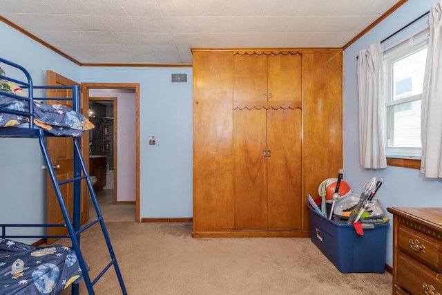 1014 N Main St, Pontiac, IL 61764 - bedroom with light colored carpet and ornamental molding