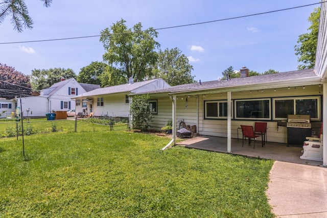 1014 N Main St, Pontiac, IL 61764 - rear view of house featuring a patio and a chimney