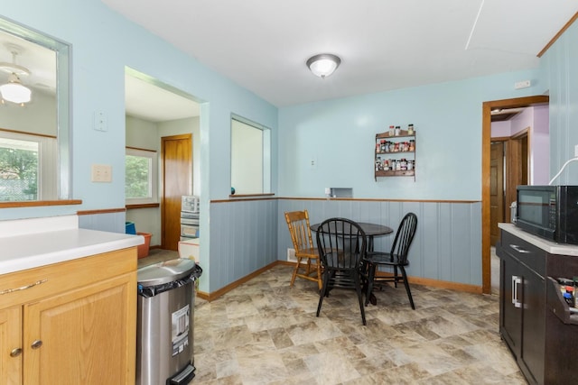 1014 N Main St, Pontiac, IL 61764 - dining room with stone finish floors and wainscoting