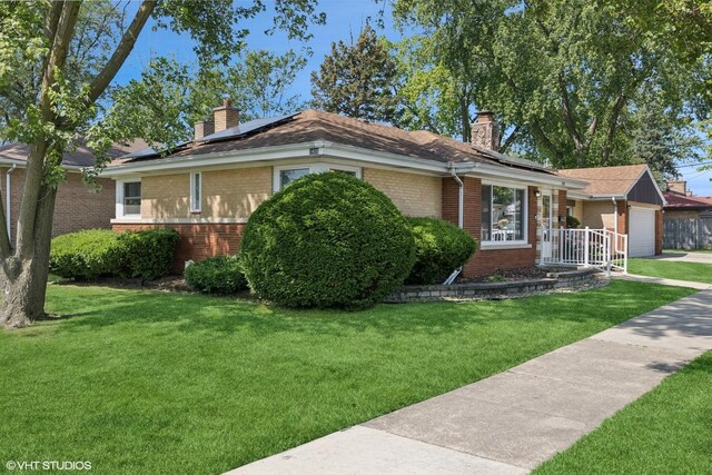 1400 Boeger Ave, Westchester, IL 60154 - single story home with brick siding, a chimney, a front lawn, roof mounted solar panels, and an attached garage