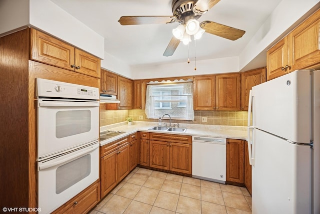 1400 Boeger Ave, Westchester, IL 60154 - kitchen featuring white appliances, tasteful backsplash, brown cabinetry, and under cabinet range hood