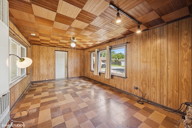 1400 Boeger Ave, Westchester, IL 60154 - unfurnished room with wooden walls, tile patterned floors, a ceiling fan, and wood ceiling