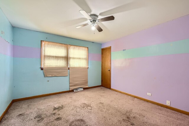 14433 Woodlawn Ave, Dolton, IL 60419 - carpeted empty room featuring ceiling fan and baseboards