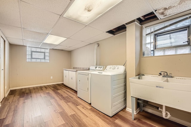 14433 Woodlawn Ave, Dolton, IL 60419 - laundry room with washing machine and dryer, cabinet space, and light wood-type flooring