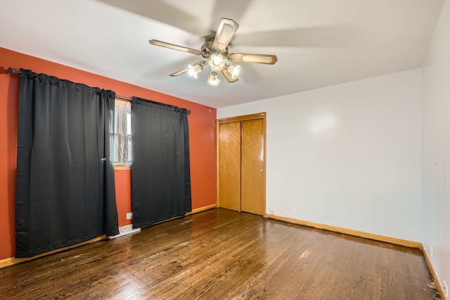 14433 Woodlawn Ave, Dolton, IL 60419 - unfurnished bedroom with wood finished floors, a closet, and a ceiling fan