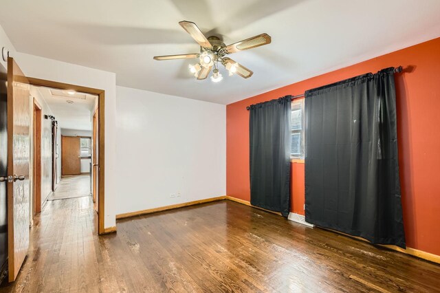 14433 Woodlawn Ave, Dolton, IL 60419 - unfurnished room featuring wood finished floors and ceiling fan