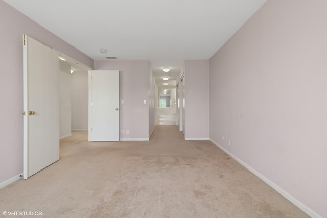 406 Cascade Ln Unit 406, Oswego, IL 60543 - empty room featuring carpet floors and baseboards