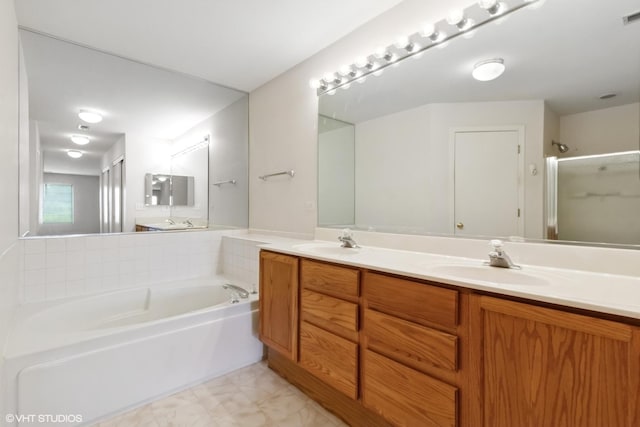 406 Cascade Ln Unit 406, Oswego, IL 60543 - full bathroom featuring double vanity, a bath, a stall shower, and marble finish floors