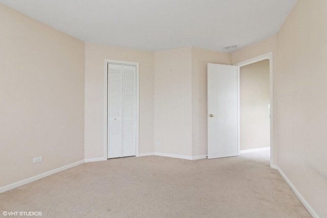 406 Cascade Ln Unit 406, Oswego, IL 60543 - unfurnished bedroom featuring carpet and a closet