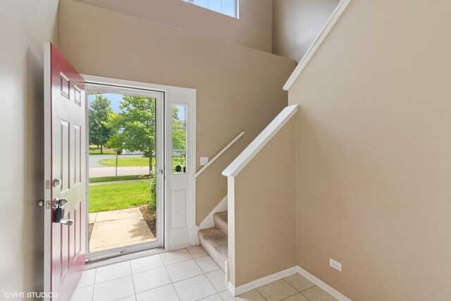 406 Cascade Ln Unit 406, Oswego, IL 60543 - entrance foyer featuring plenty of natural light, stairs, and light tile patterned floors