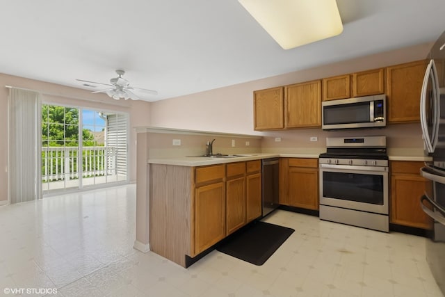 406 Cascade Ln Unit 406, Oswego, IL 60543 - kitchen with stainless steel appliances, light countertops, a ceiling fan, brown cabinets, and light floors