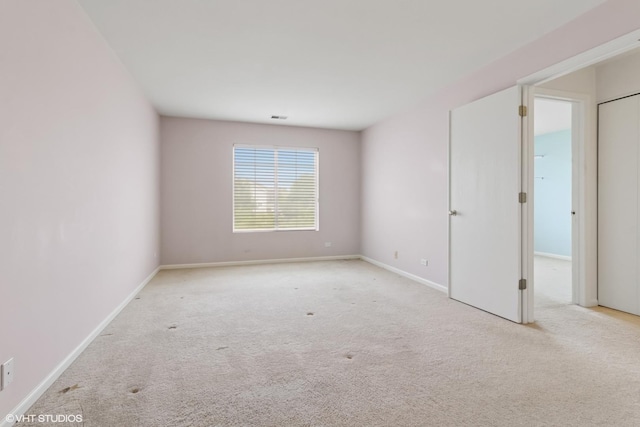 406 Cascade Ln Unit 406, Oswego, IL 60543 - empty room with carpet flooring and baseboards