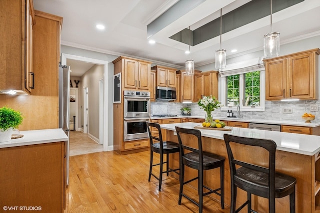 8736 Shade Tree Cir, Lakewood, IL 60014 - kitchen featuring appliances with stainless steel finishes, a breakfast bar, crown molding, light countertops, and decorative backsplash