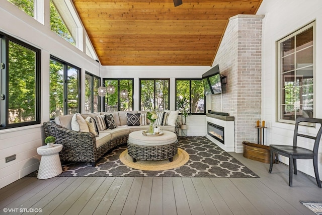 8736 Shade Tree Cir, Lakewood, IL 60014 - sunroom / solarium featuring an outdoor living space with a fireplace and vaulted ceiling