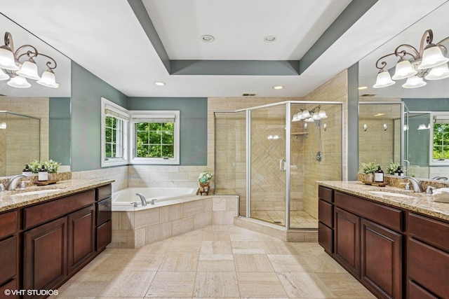 8736 Shade Tree Cir, Lakewood, IL 60014 - full bathroom featuring a chandelier, two vanities, plenty of natural light, and recessed lighting