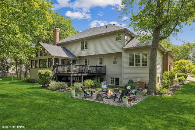 8736 Shade Tree Cir, Lakewood, IL 60014 - rear view of house featuring a sunroom, a deck, a fire pit, a yard, and a shingled roof