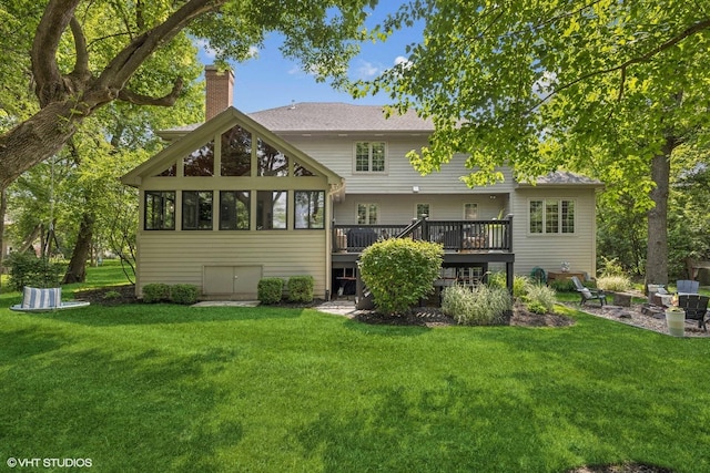 8736 Shade Tree Cir, Lakewood, IL 60014 - rear view of property featuring a chimney, a deck, and a lawn