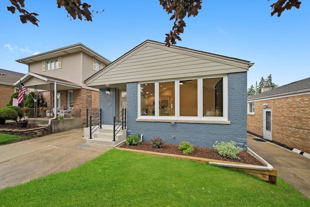 5246 S New England Ave, Chicago, IL 60638 - bungalow featuring a front lawn, brick siding, and a porch