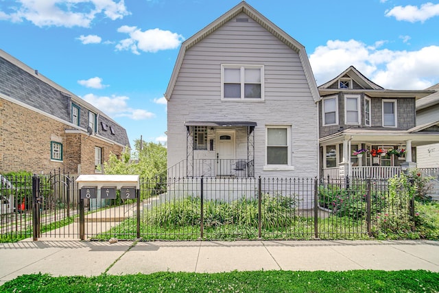 4125 W School St, Chicago, IL 60641 - dutch colonial featuring a gambrel roof and a fenced front yard