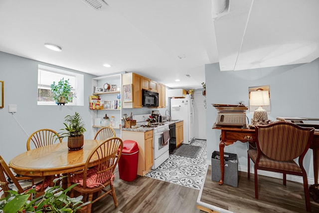 4125 W School St, Chicago, IL 60641 - kitchen featuring white appliances, light countertops, open shelves, light wood-style flooring, and recessed lighting