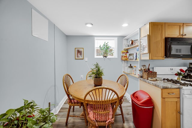 4125 W School St, Chicago, IL 60641 - dining area featuring wood finished floors and recessed lighting