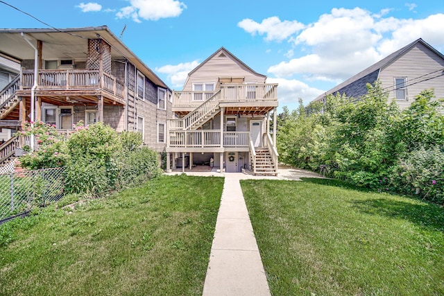 4125 W School St, Chicago, IL 60641 - rear view of property featuring stairway, a yard, a deck, and a patio